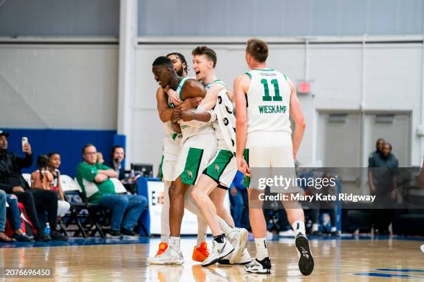 The the Main Celtics celebrate after Tony Snell of the Maine Celtics hit the game-winning shot against the Delaware Blue Coats on March 13, 2024 at...