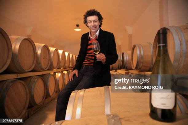 French wine grower Gerard Bertrand tastes a cup of his white wine Cigalus, on 4 February, 2008 in his cellar in Bizanet, southwestern France. His...