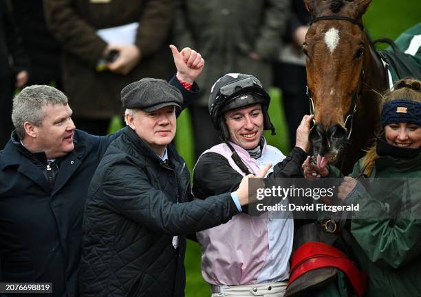 Gloucestershire , United Kingdom - 14 March 2024; Trainer Gordon Elliott, left, winning connections and jockey Jack Kennedy celebrate with Teahupoo...