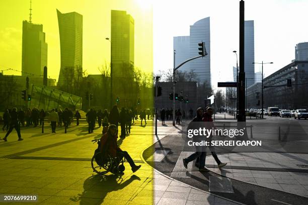 People make thier way down the street during a sunny day in Warsaw, Poland on March 14, 2024.