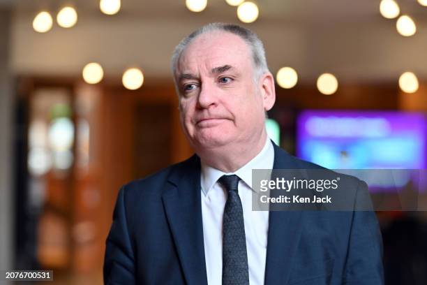 Richard Lochhead, Minister for Small Business, Innovation, Tourism and Trade, on the way to First Minister's Questions in the Scottish Parliament, on...