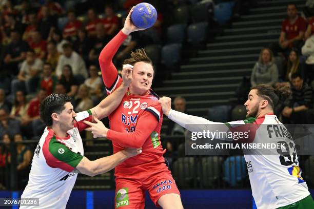 Norway's center back Tobias Grondahl vies with Portugal's left back Salvador Salvador and Portugal's Luis Frade during the men's Handball Olympic...