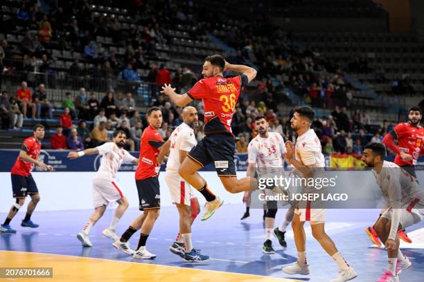 Spain's centre back Ian Tarrafeta Serrano attempts a shoot during the qualifying handball match for the 2024 Paris Olympic Games between Spain and...