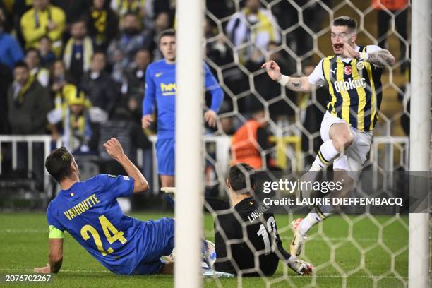 Union's Charles Vanhoutte, Union's goalkeeper Heinz Lindner and Fenerbahce's Ryan Kent fight for the ball during a soccer game between Turkish club...