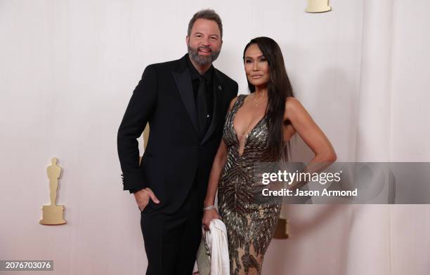 Hollywood, CA Paul Debevec and Tia Carrere arriving on the red carpet at the 96th Annual Academy Awards in Dolby Theatre at Hollywood & Highland...