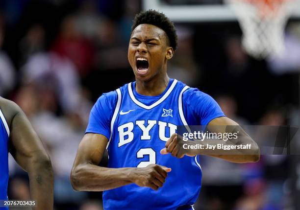 Jaxson Robinson of the Brigham Young Cougars reacts after scoring during the second half of a quarterfinal game of the Big 12 Men's Basketball...