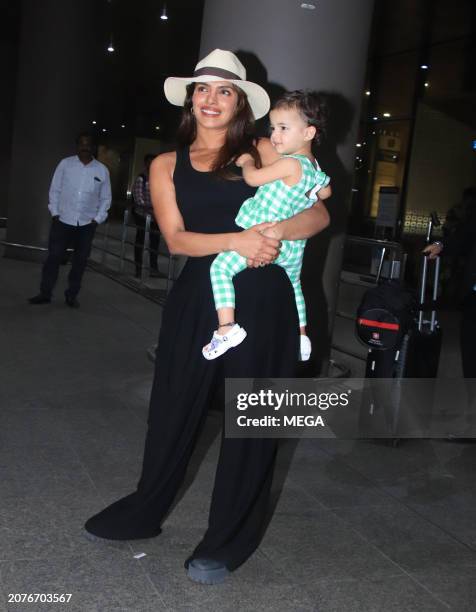 Priyanka Chopra and Malti Marie Chopra Jonas are seen arriving at Mumbai Airport on March 14, 2024 in Mumbai, India.