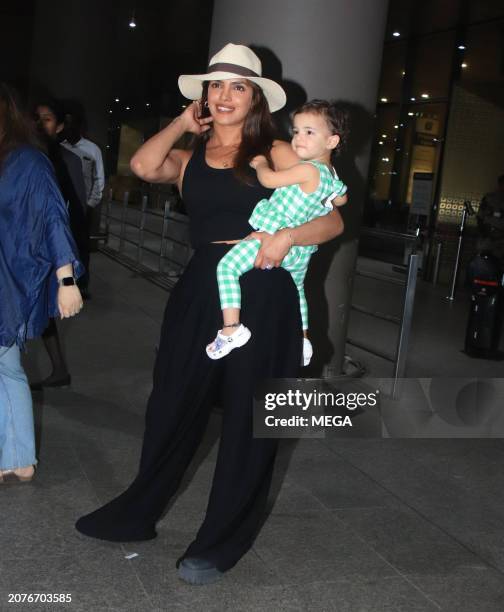 Priyanka Chopra and Malti Marie Chopra Jonas are seen arriving at Mumbai Airport on March 14, 2024 in Mumbai, India.