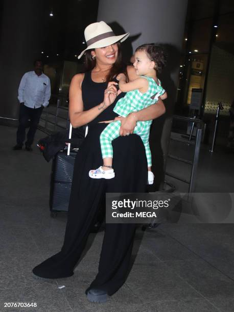 Priyanka Chopra and Malti Marie Chopra Jonas are seen arriving at Mumbai Airport on March 14, 2024 in Mumbai, India.