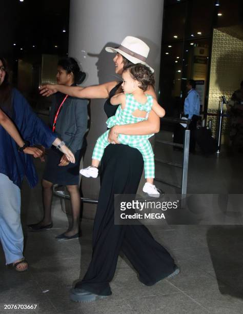 Priyanka Chopra and Malti Marie Chopra Jonas are seen arriving at Mumbai Airport on March 14, 2024 in Mumbai, India.