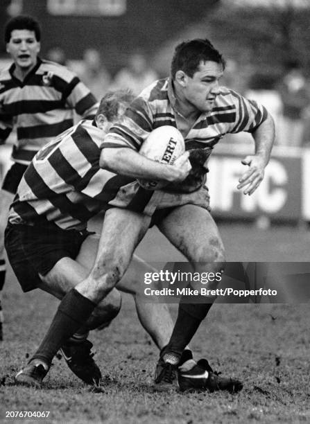 Mike Kenrick of Sale ins tackled during the Courage League National Division Two match between Sale and Orrell at Heywood Road on February 8, 1992 in...