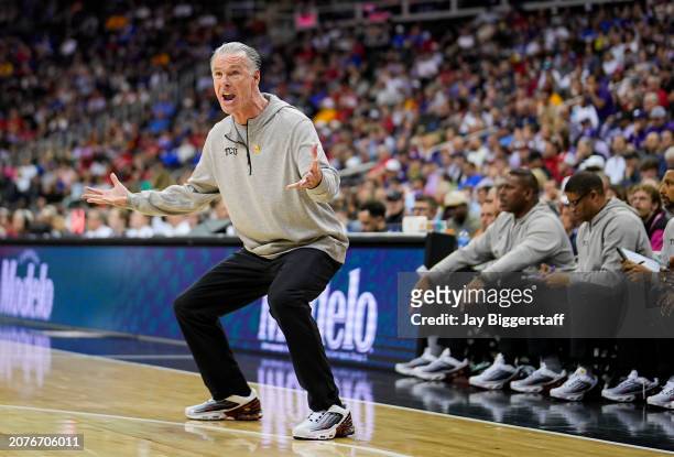 Head coach Jamie Dixon of the TCU Horned Frogs reacts to a foul call during the first half of a quarterfinal game of the Big 12 Men's Basketball...