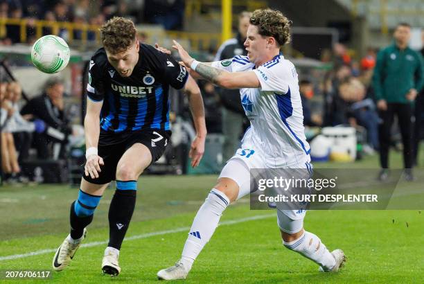 Club Brugge's Danish midfielder Andreas Skov Olsen fights for the ball with Molde's Norwegian defender Mathias Fjortoft Lovik during the 2023-2024...