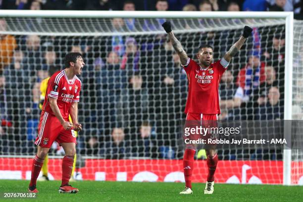 Joao Neves celebrates with Nicolas Otamendi of Benfica at full time following victory during the UEFA Europa League 2023/24 round of 16 second leg...