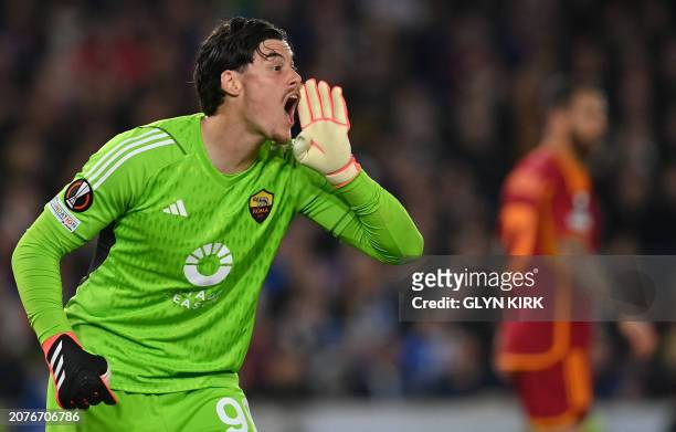 Roma's Serbian goalkeeper Mile Svilar shouts to teammates during the UEFA Europa League round of 16 second leg football match between Brighton and...