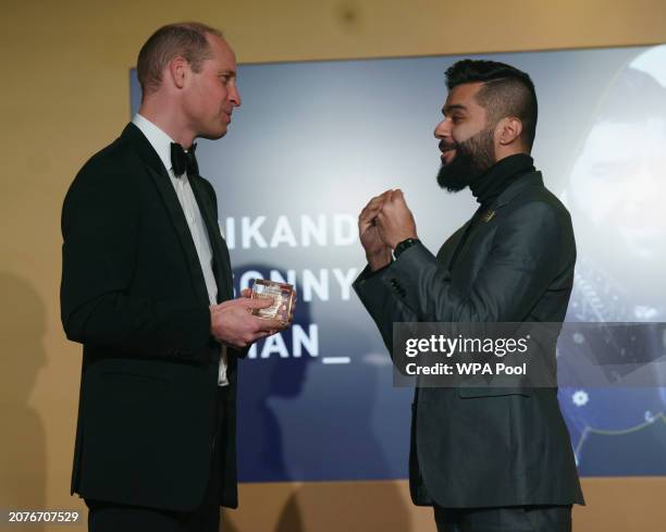 Prince William, Prince of Wales meets Sikander Sonny Kahn from the USA as he attends The Diana Legacy Awards at the Science Museum on March 14, 2024...