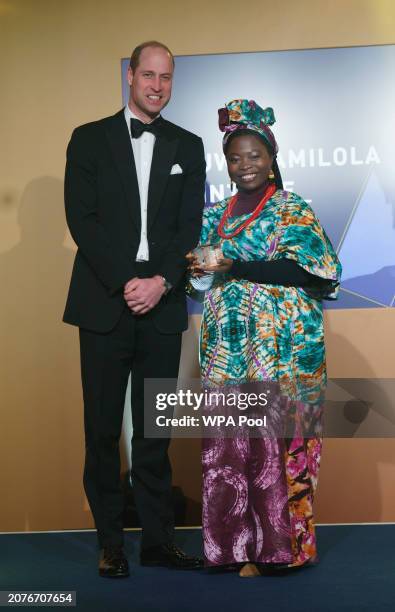 Prince William, Prince of Wales meets Oluwadamilola Akintewe as he attends The Diana Legacy Awards at the Science Museum on March 14, 2024 in London,...