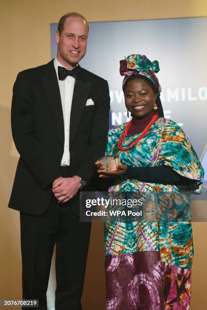 Prince William, Prince of Wales meets Oluwadamilola Akintewe as he attends The Diana Legacy Awards at the Science Museum on March 14, 2024 in London,...