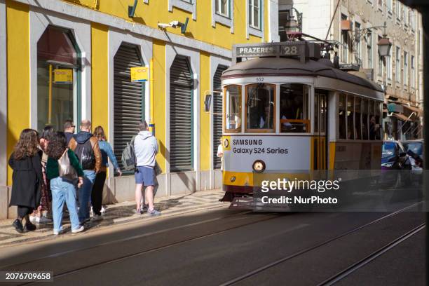 People are waiting for the electric tram in Lisbon, Portugal, on March 14, 2024. Portugal is rated as the seventh most peaceful country in the world...