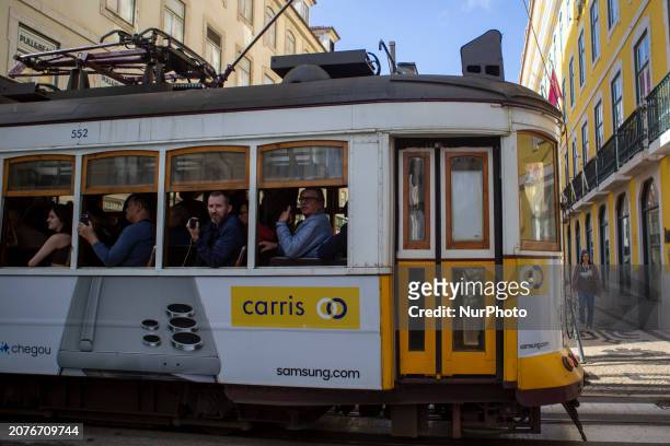 People are riding the electric tram in Lisbon, Portugal, on March 14, 2024. Portugal is rated as the seventh most peaceful country in the world...