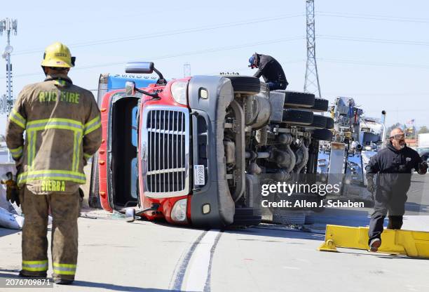 Gusty Santa Ana winds toppled this Amazon box truck on the 60 Freeway east transition to the 15 Freeway north. It was a single vehicle accident with...