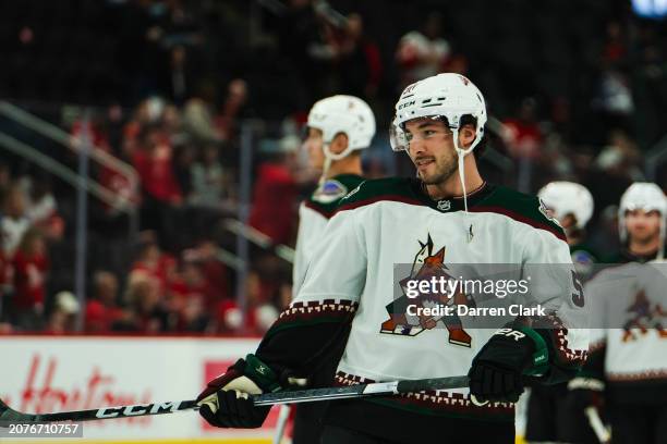 Sean Durzi of the Arizona Coyotes during warmups against the Detroit Red Wings at Little Caesars Arena on March 14, 2024 in Detroit, Michigan.