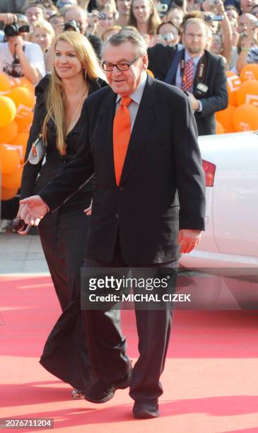 Czech born US director Milos Forman accompanied with his wife Martina walks the red carpet to attend the opening ceremony of the 44th Karlovy Vary...