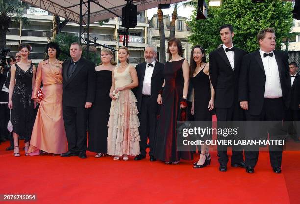 British director Mike Leigh arrives with his actors at the Palais des festivals to attend the gala screening of their film "All or nothing" during...