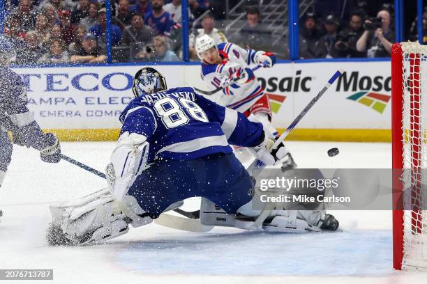 Artemi Panarin of the New York Rangers scores past Andrei Vasilevskiy of the Tampa Bay Lightning during the first period at the Amalie Arena on March...