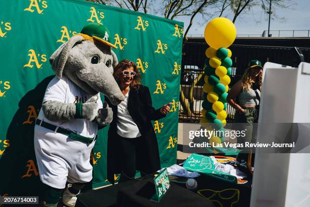 Oakland Athletics mascot Stomper poses for photographs with fans during a Big League Weekend game between the Oakland A's and Milwaukee Brewers at...