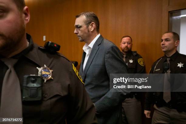 James Crumbley, the father of Oxford High School school shooter Ethan Crumbley, enters the courtroom to hear the jury's verdict on four counts of...