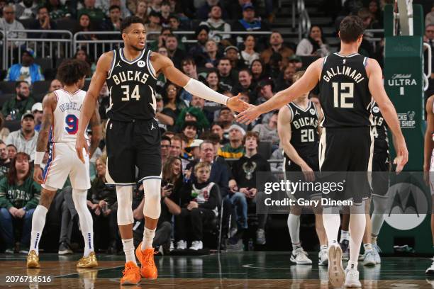 Giannis Antetokounmpo of the Milwaukee Bucks high fives Danilo Gallinari during the game against the Philadelphia 76ers on March 14, 2024 at the...