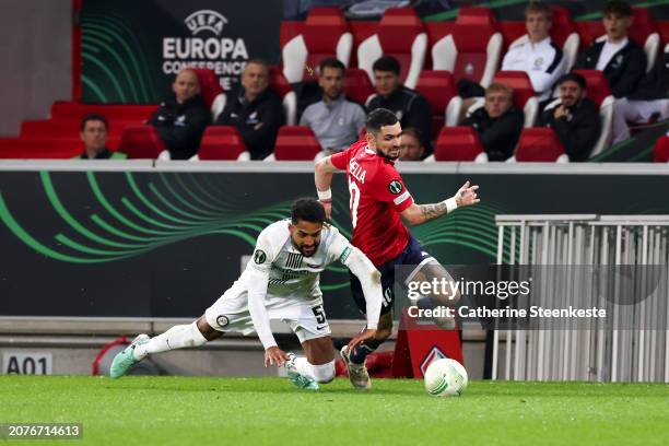 Gregory Wuthrich of SK Sturm Graz challenges Remy Cabella of Lille OSC during the UEFA Europa Conference League 2023/24 round of 16 second-leg match...