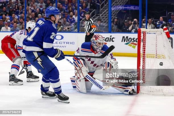 Brayden Point of the Tampa Bay Lightning scores past Igor Shesterkin of the New York Rangers during the second period at the Amalie Arena on March...