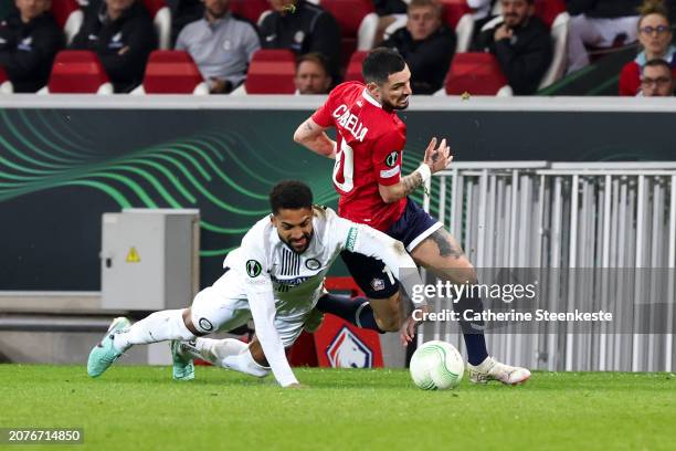 Gregory Wuthrich of SK Sturm Graz challenges Remy Cabella of Lille OSC during the UEFA Europa Conference League 2023/24 round of 16 second-leg match...