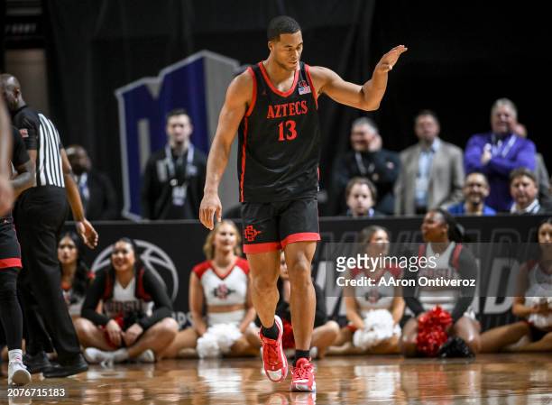 Jaedon LeDee of the San Diego State Aztecs waves to the bench after being called for a travel against the UNLV Rebels during the overtime period of...