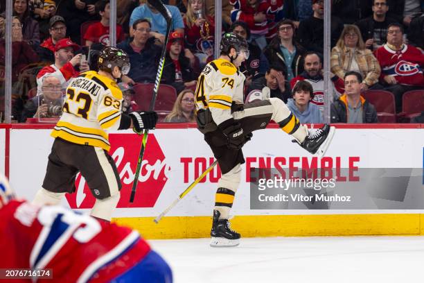 Jake DeBrusk of the Boston Bruins celebrates scoring against the Montreal Canadiens during the overtime period of the NHL regular season game at the...