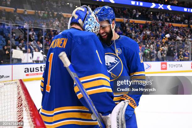 Jordan Greenway celebrates with Ukko-Pekka Luukkonen of the Buffalo Sabres following an NHL game against the New York Islanders on March 14, 2024 at...