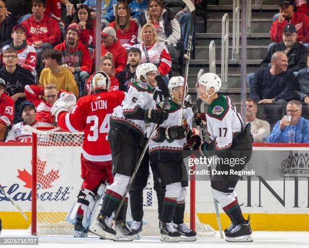 Nick Bjugstad of the Arizona Coyotes celebrates his goal on Alex Lyon of the Detroit Red Wings with teammates during the third period at Little...