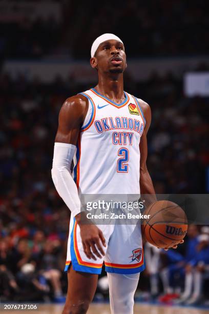 Shai Gilgeous-Alexander of the Oklahoma City Thunder shoots a free throw during the game against the Denver Nuggets on March 13, 2024 at Paycom Arena...