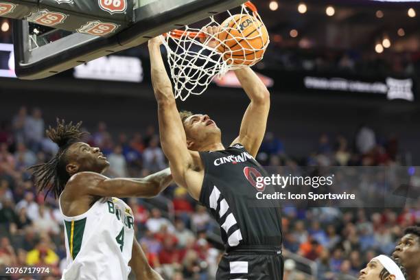 Cincinnati Bearcats guard Dan Skillings Jr. Dunks the ball in the first half of a Big 12 tournament quarterfinal game between the Cincinnati Bearcats...