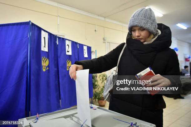 Woman votes in Russia's presidential election in the Siberian city of Novosibirsk on March 15, 2024.