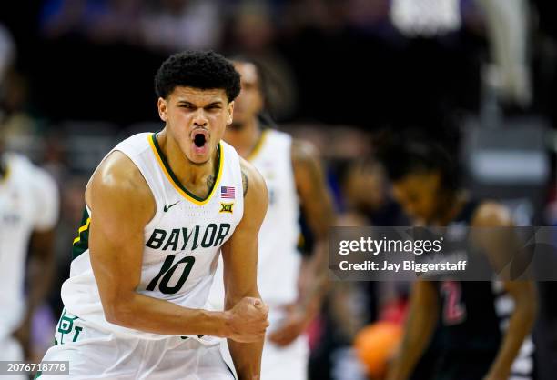 RayJ Dennis of the Baylor Bears celebrates after scoring during the second half of a quarterfinal game of the Big 12 Men's Basketball Tournament...