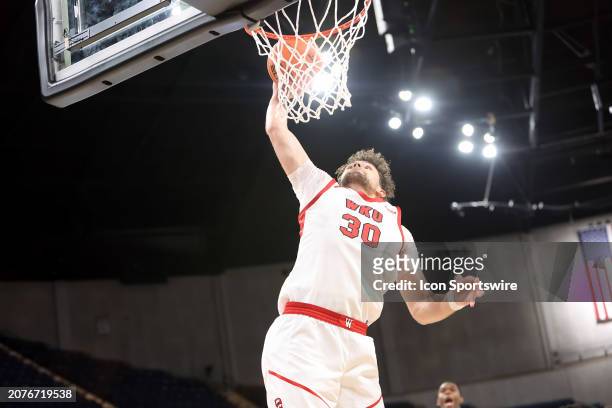 Hilltoppers guard Teagan Moore dunks the ball during the quarterfinal game of the 2024 Conference USA Men's Basketball Championship between the...