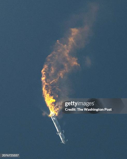 SpaceX's Starship spacecraft and Super Heavy rocket turns upside down and explodes during launch from Starbase on April 20, 2023.