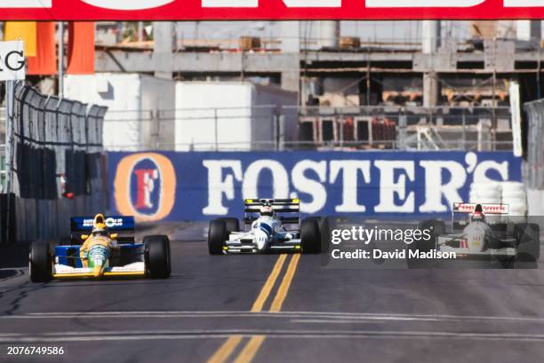 Roberto Moreno of Brazil and Benetton-Ford, Stefan Johansson of Sweden and AGS-Ford, and Alex Caffi of Italy and Footwork-Porsche compete in the...