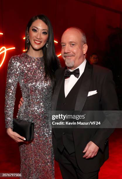 Clara Wong and Paul Giamatti attend the 2024 Vanity Fair Oscar Party Hosted By Radhika Jones at Wallis Annenberg Center for the Performing Arts on...