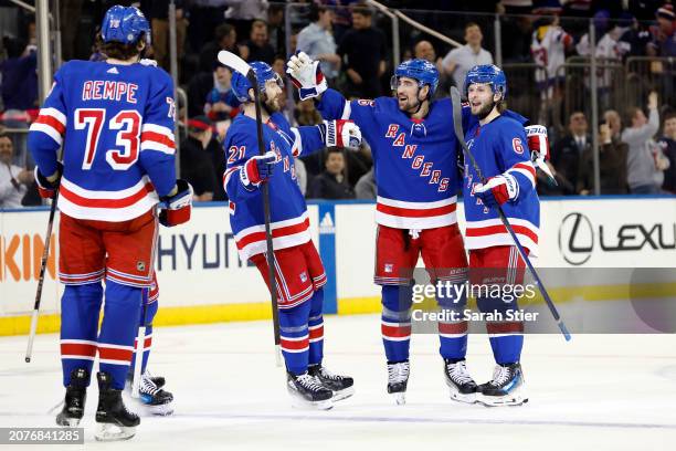 Erik Gustafsson celebrates with Zac Jones, Barclay Goodrow, and Matt Rempe of the New York Rangers after scoring a goal during the second period...