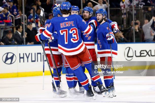 Erik Gustafsson celebrates with Zac Jones, Barclay Goodrow, and Matt Rempe of the New York Rangers after scoring a goal during the second period...