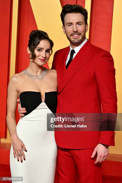 Alba Baptista and Chris Evans attend the 2024 Vanity Fair Oscar Party Hosted By Radhika Jones at Wallis Annenberg Center for the Performing Arts on...